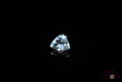 a blue diamond on a black background