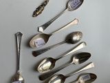 a lot of spoons that are sitting on a table