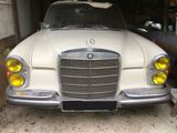 a white car that is parked in a garage