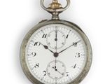 a close up of a pocket watch on a white background