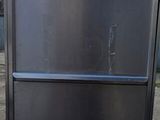stainless steel refrigerators stacked on top of each other in a parking lot