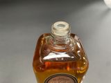 a bottle of liquid that is sitting on a table