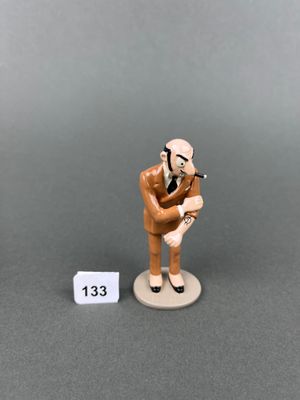 a small figurine of a man holding a baseball bat