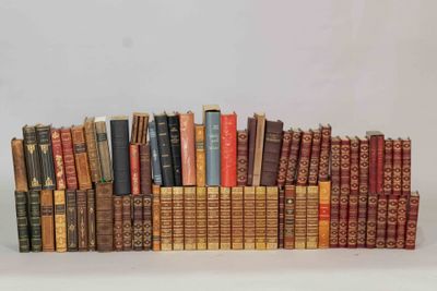 many old books stacked on top of each other