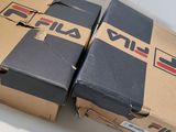two boxes are stacked on top of each other on a table