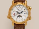 a close up of a gold wrist watch with a brown leather strap