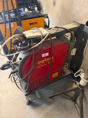 a welding machine that is sitting on a cart