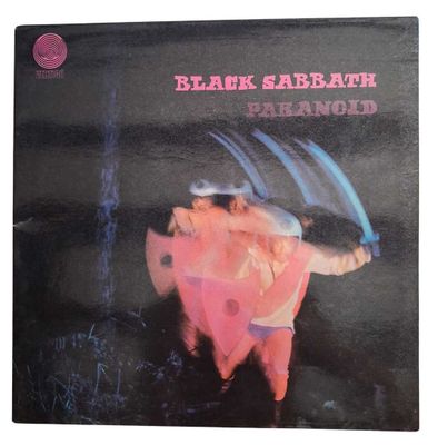 a black sabbath album with a picture of a man holding a knife