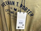 a t - shirt with a tag on it hanging on a rack