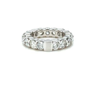 a close up of a diamond ring on a white background