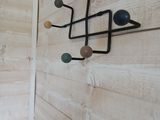 a wooden wall with a coat rack on it