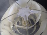 a close up of a blender with a white object inside of it
