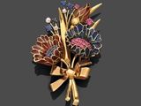 une image représentant une broche ornée de fleurs et de rubans sur un fond noir