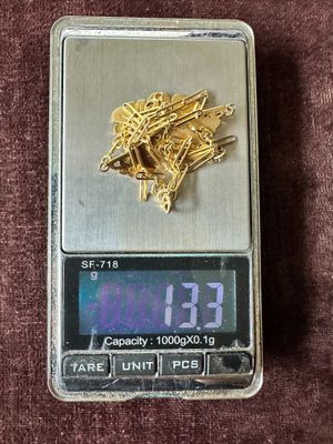 a scale with a bunch of screws on top of it