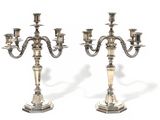 pair of silver plated candelabs with candlesticks on stands