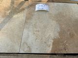 a lot of tile on the ground with a price tag on it