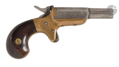 an old revolver with a wooden handle on a white background
