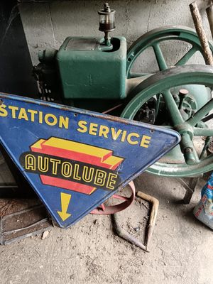 a sign that says station service on the side of a building