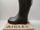 an image of a pair of rain boots sitting on top of a box