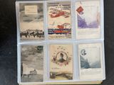 many old postcards in a plastic box on a table