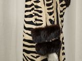 an image of a woman ' s zebra print coat with a fur collar