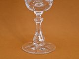a wine glass that is sitting on a table