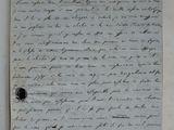 an old document with writing on it sitting on top of a table