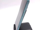 a cell phone that is sitting on a stand