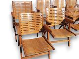 six wooden chairs that are lined up in a row