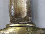 a close up of a brass object on a table