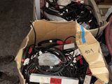 a box full of wires and wires sitting on the floor