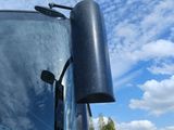reflection of a bus on the windshield of a vehicle