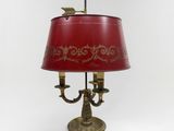an image of a table lamp with a red shade on it