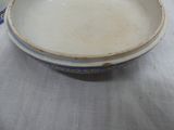 a bowl that is sitting on a table next to a cup