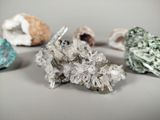 several crystals are arranged in a circle on a white surface