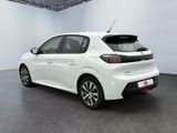 the rear end of a white car in a white room