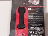 a black and red object in a plastic package