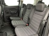two seats in the back of a van that are empty