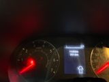 a close up of a car dashboard with a speedometer