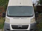 a white van that is parked on the side of the road