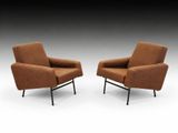 pair of lounge chairs in brown fabric with black legs