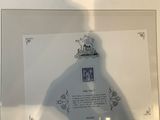 a shadow of a person standing in front of a picture