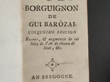 an old book with a black writing on it