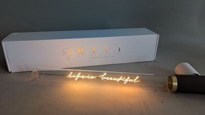a close up of a light bulb with a box in the background