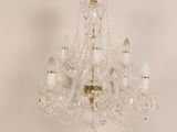 an image of a crystal chandelier hanging from a ceiling