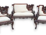 three chairs with white cushions and a white cushion on them
