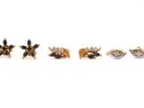 un lot de cinq paires de boucles d'oreilles ornées de pierres noires et blanches