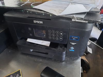 a printer that is sitting on top of a table