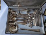 a box with a bunch of silver spoons and spoons