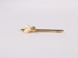 a pair of gold screws on a white background